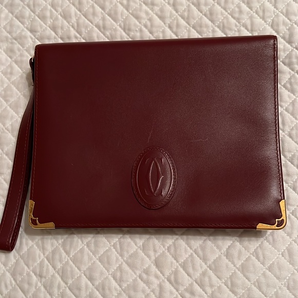 Cartier Handbags - Cartier clutch/wristlet. Great condition.